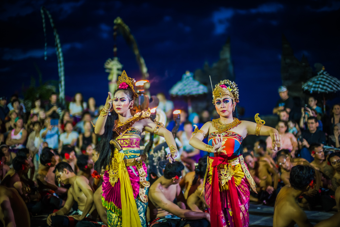 Two Women Dancing While Wearing Dresses at Night Time